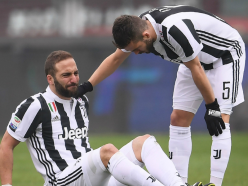 Higuain limps off injured after colliding with Torino goalkeeper